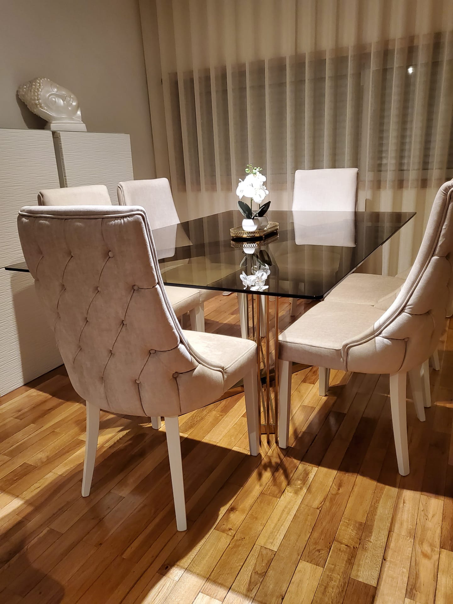 Tufted chairs with glass table