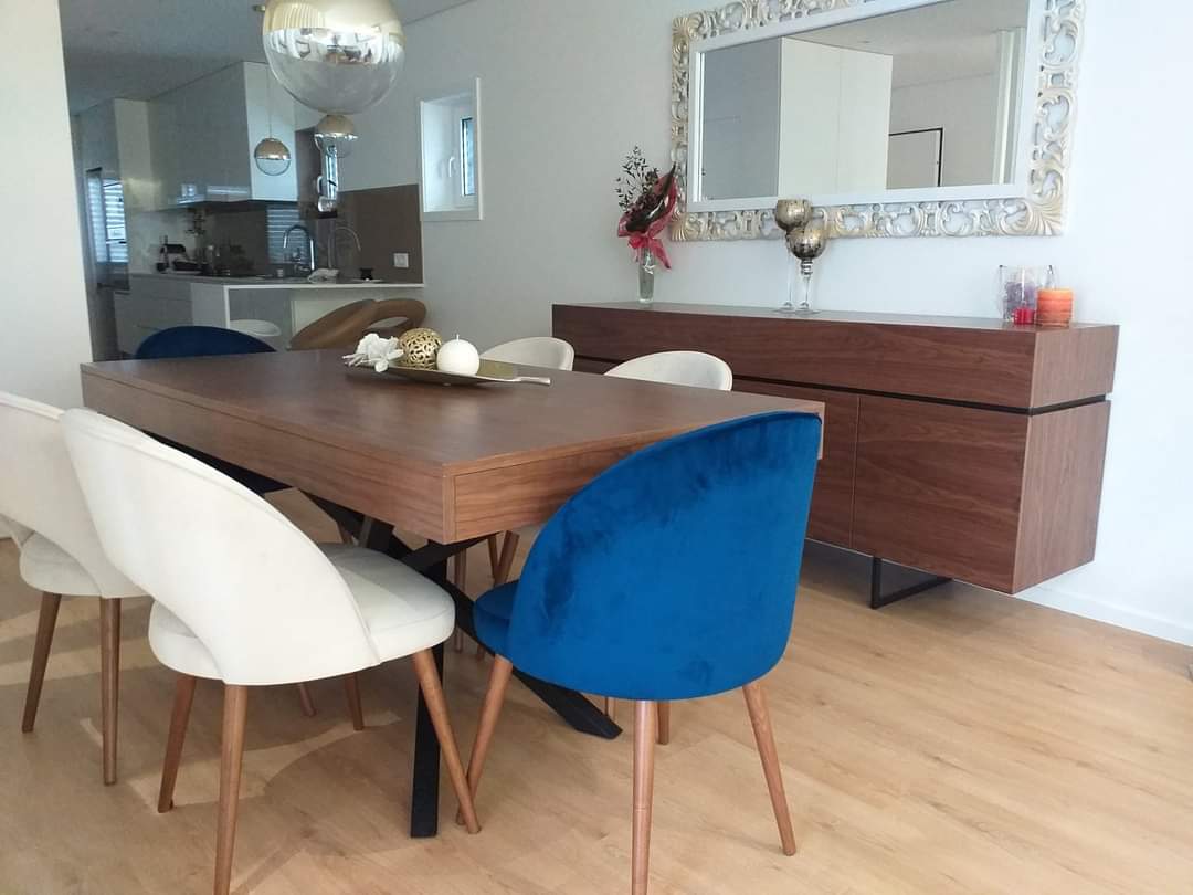 Walnut dining table with mixed chairs